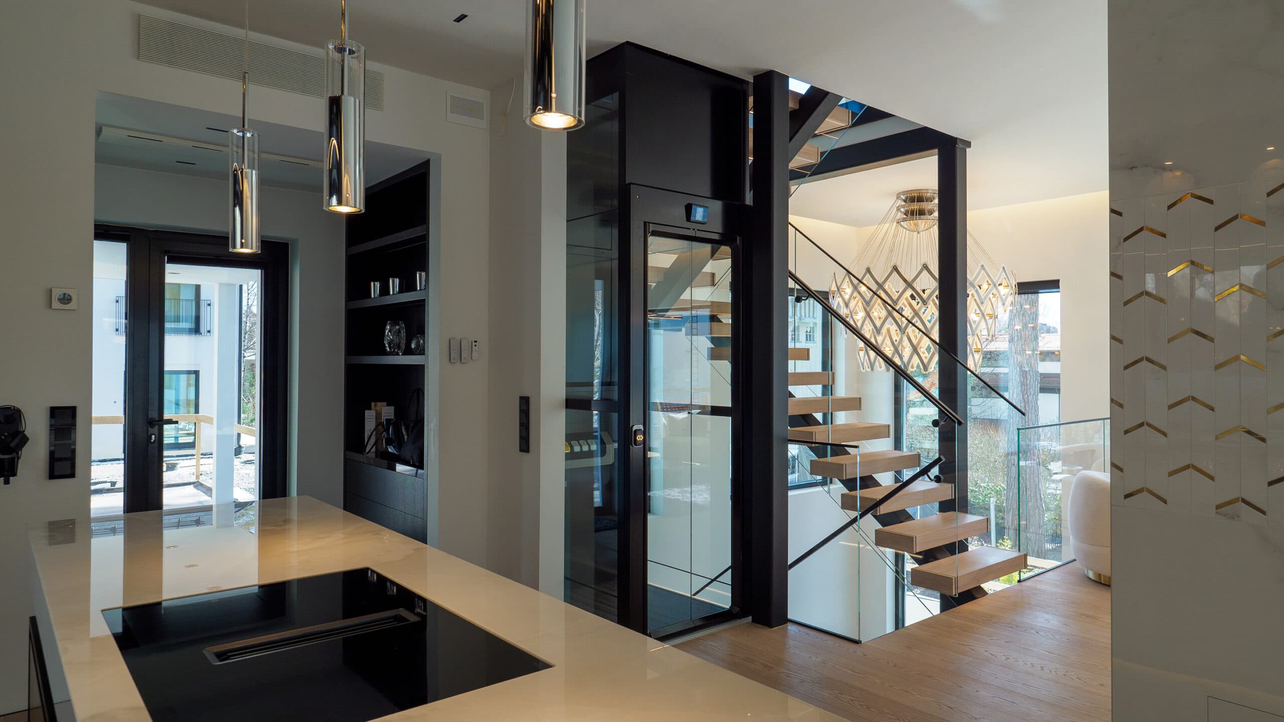 Black Cibes Cloud Plus with glazed shaft installed in a staircase in a modern designer home in Finland.