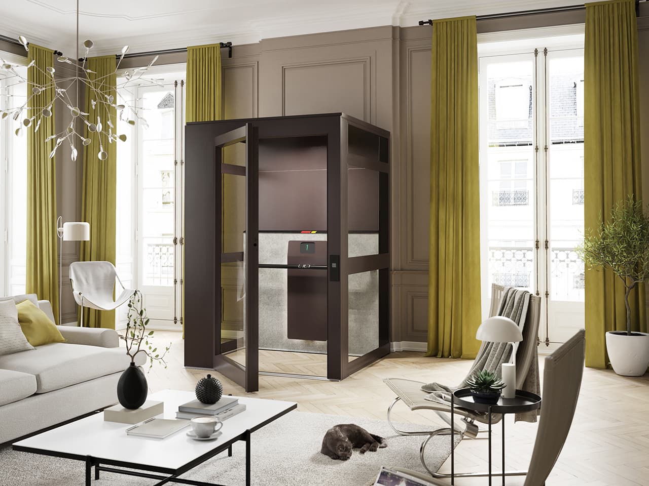 A 19th century style living room with a small, glass-enclosed Cibes Air home elevator at the center, surrounded by beige walls, green curtains, and large windows. The room includes a white sofa, a coffee table with decor, a lounge chair, and a brown cat resting on a rug.